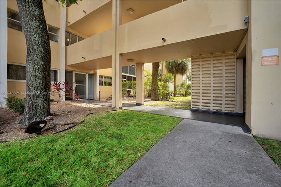 Front view of a building entrance with covered walkway.