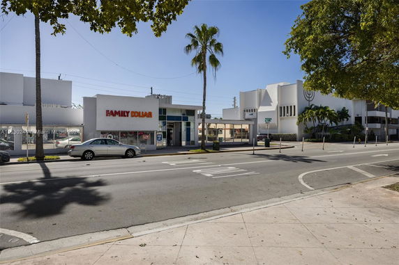 Front view of a Family Dollar store with adjacent buildings on a street.