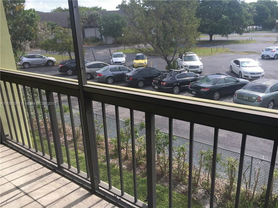 View of a parking area from a balcony.