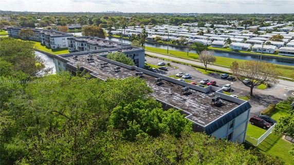 Rooftop view of residential buildings with visible air conditioning units.