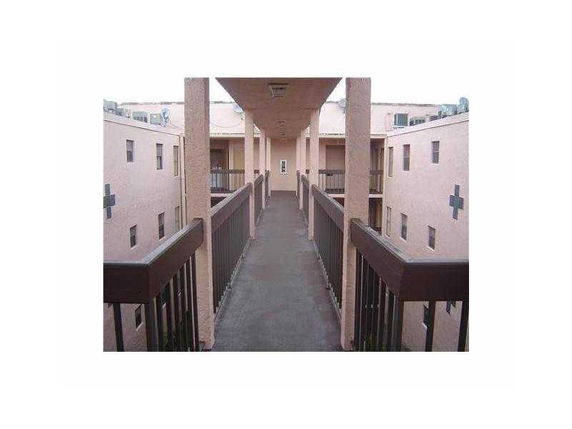 View of a rooftop walkway between buildings.