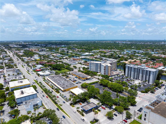 Aerial view of an urban area with multiple buildings and streets.