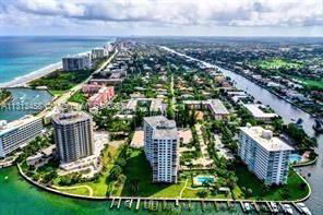 Panoramic view of a coastal area featuring several high-rise buildings and waterways.