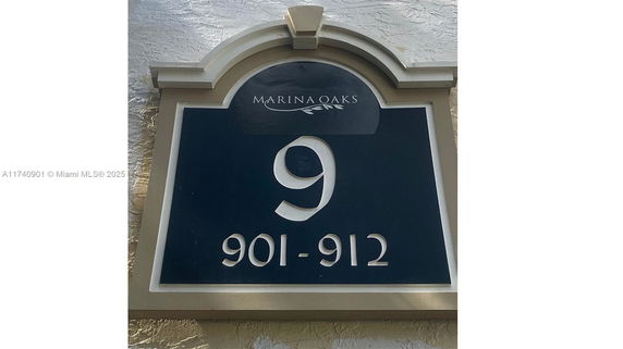 Address plaque displaying 'Marina Oaks' and numbers 901-912.