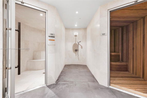 Indoor view of a steam room and sauna in a wellness facility.