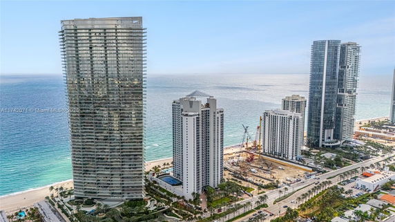 High-rise buildings overlooking the ocean and cityscape.