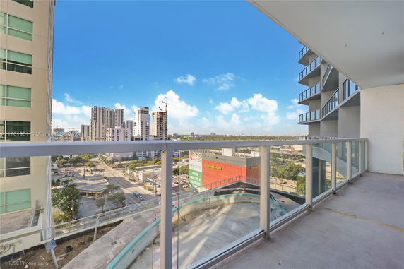 View of surrounding urban area from a high-rise balcony.