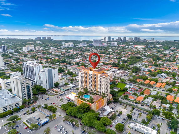 Panoramic view of a cityscape with residential and commercial buildings.
