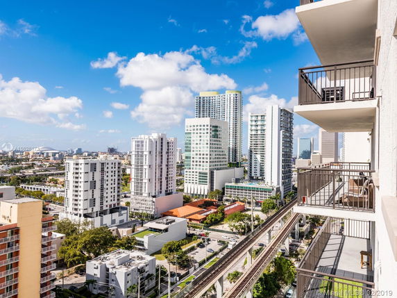 Panoramic view of a cityscape with multiple high-rise buildings.