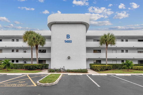 Front view of a multi-story building with a central structure marked B 1480.