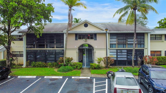 Front view of a two-story residential building with multiple units.