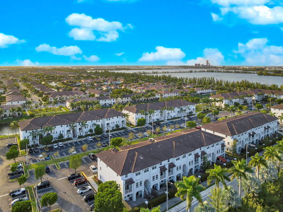 Panoramic view of multiple residential buildings and surrounding area.