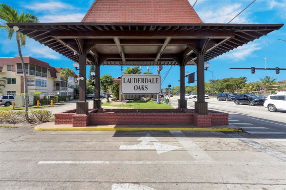 Front view of a structure with a sign reading Lauderdale Oaks.