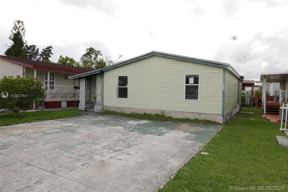 Front view of a single-story house with a driveway.