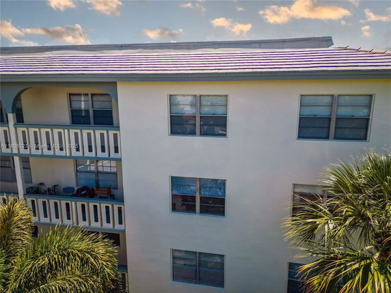 Exterior view of a multi-story building with balconies.
