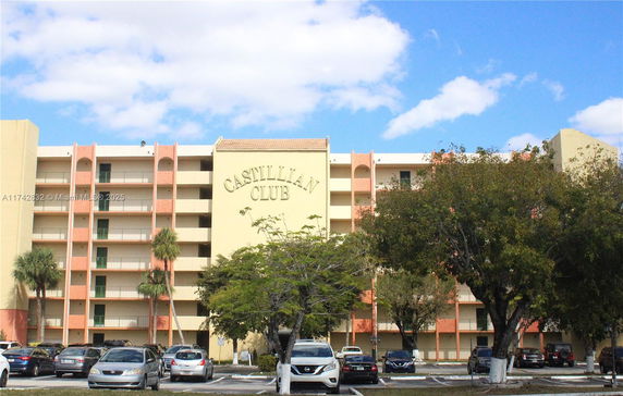 Front view of a multi-story residential building named Castillian Club.