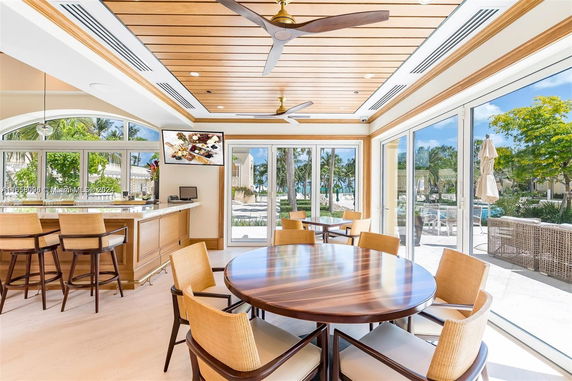 Interior view of a clubhouse with a seating area and bar.