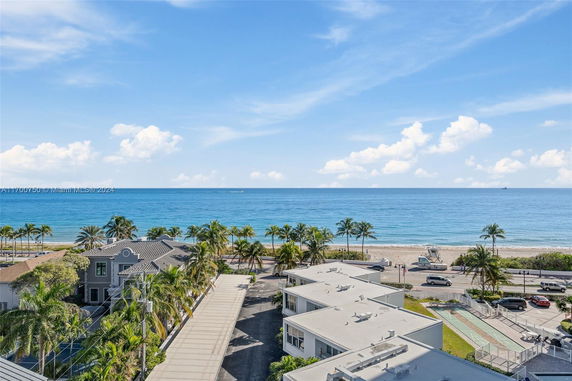 Wide-angle view overlooking the ocean from a building.