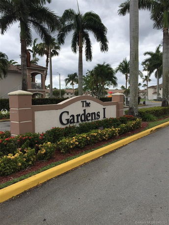 Entrance sign of a residential area labeled 'The Gardens I'.