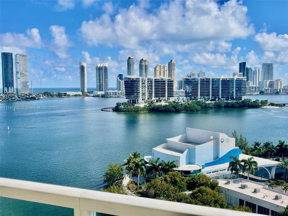 Panoramic view of a city skyline with high-rise buildings and waterbody.