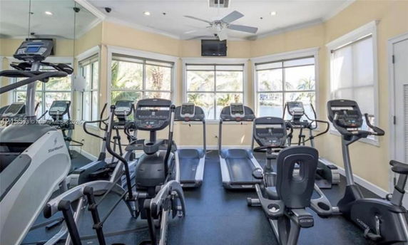 Indoor gym area with exercise equipment including treadmills and ellipticals.