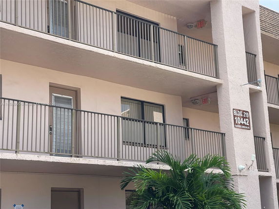 Exterior view of a multi-story building with balconies.