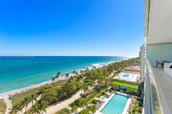 View of beachfront and surrounding areas from a high-rise building.