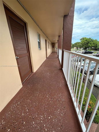 Corridor view from a building with parking area below