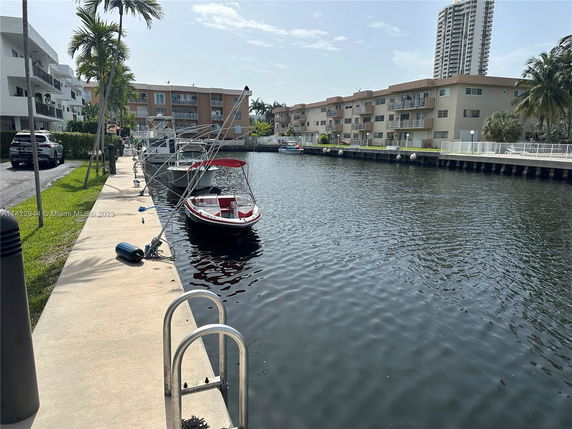 View of buildings and a canal with docked boats.