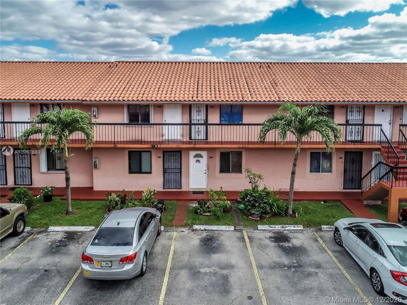 Front view of a two-story residential building with a tiled roof.