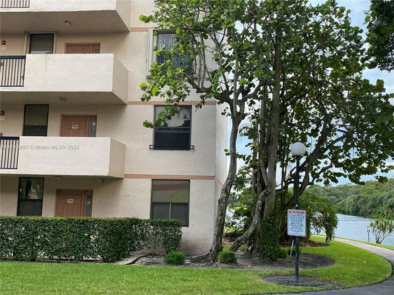 Exterior view of a multi-story residential building with balconies.