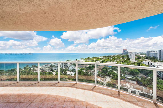 Balcony view overlooking the ocean and city skyline
