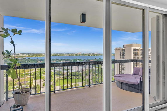 Panoramic view seen from a balcony overlooking surrounding areas with buildings and landscape.