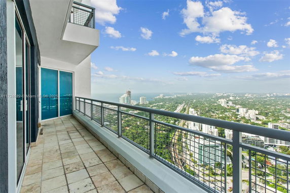 Balcony with a panoramic view of the cityscape.