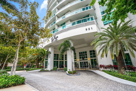Front view of a multi-story building with curved balconies.