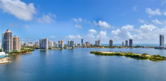 View of multiple high-rise buildings along a waterfront.