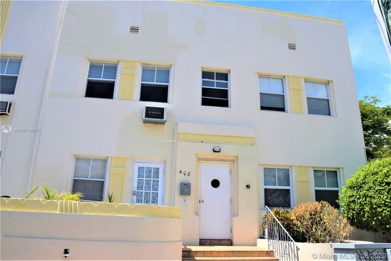 Front view of a two-story building with multiple windows and a central entrance.