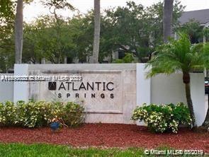 Entrance sign for Atlantic Springs residential area.