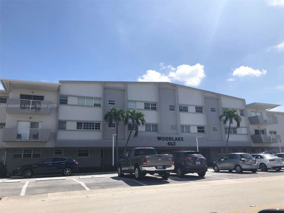 Front view of a multi-story building labeled Woodlake 462.