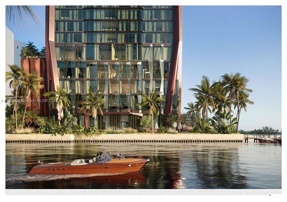 Front view of a modern multi-story building with glass facade and unique design features.