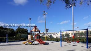 Playground with slides and swings in an outdoor park.