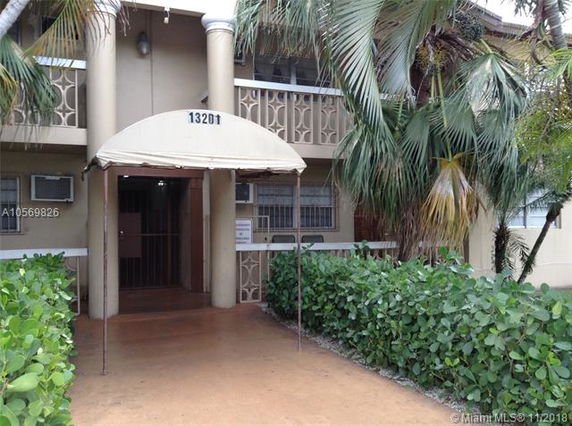 Front view of a building with a covered entrance.