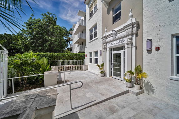 Front view of a residential building with an entrance labeled 'The Ruskin'.