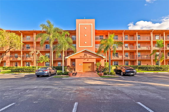 Front view of a four-story apartment building.