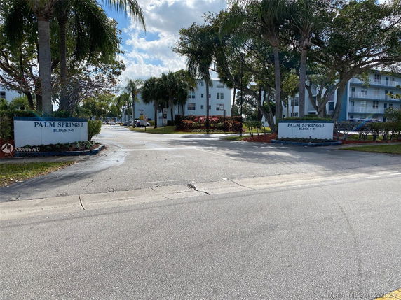 Entrance view of residential area with buildings labeled Palm Springs II.