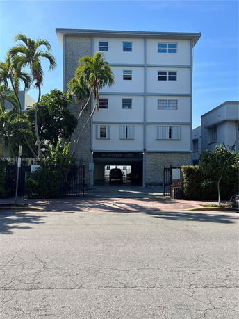 Front view of a four-story apartment building.