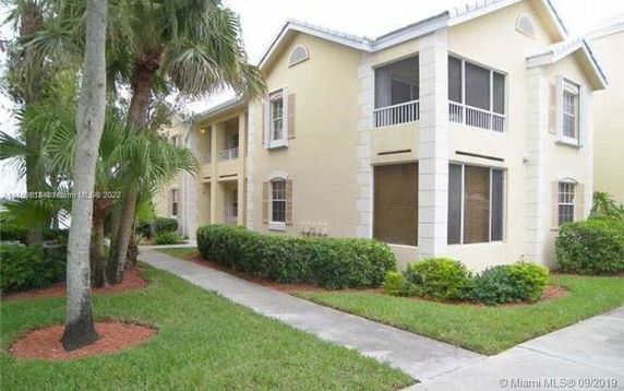 Front view of a two-story residential building with balconies.