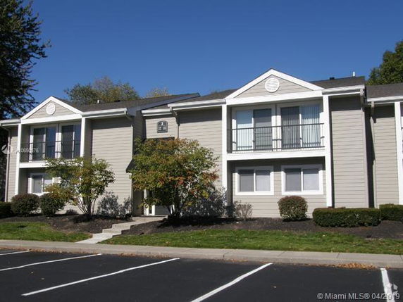 Front view of a two-story residential building with multiple units.