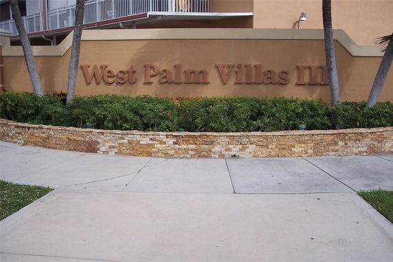 Exterior wall with signage for West Palm Villas III.
