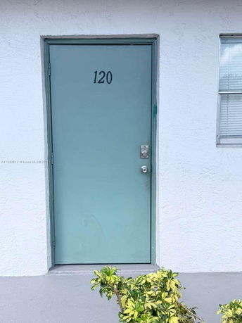 Front view of a door with the number 120.